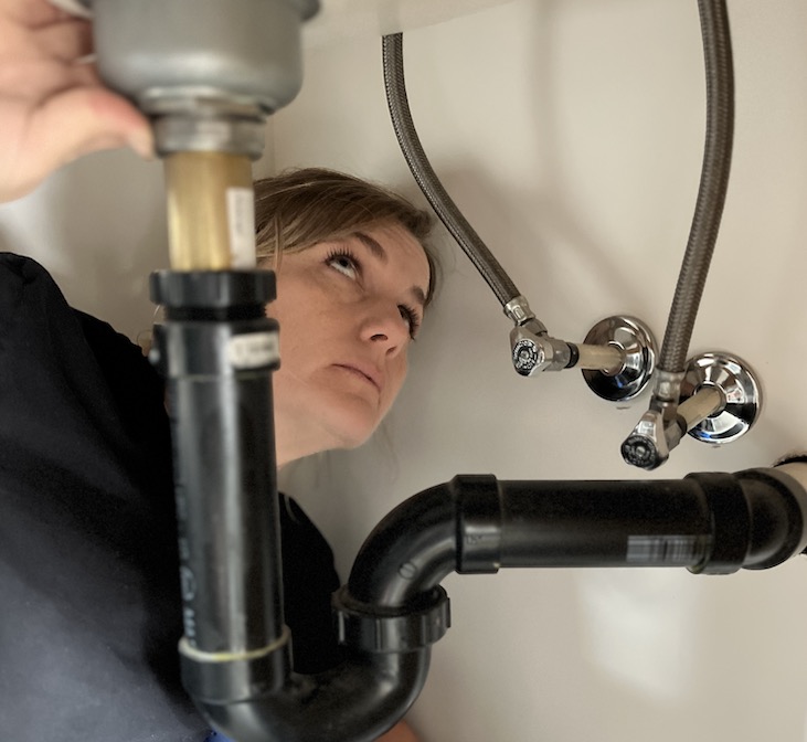 sheena grant inspecting a sink
